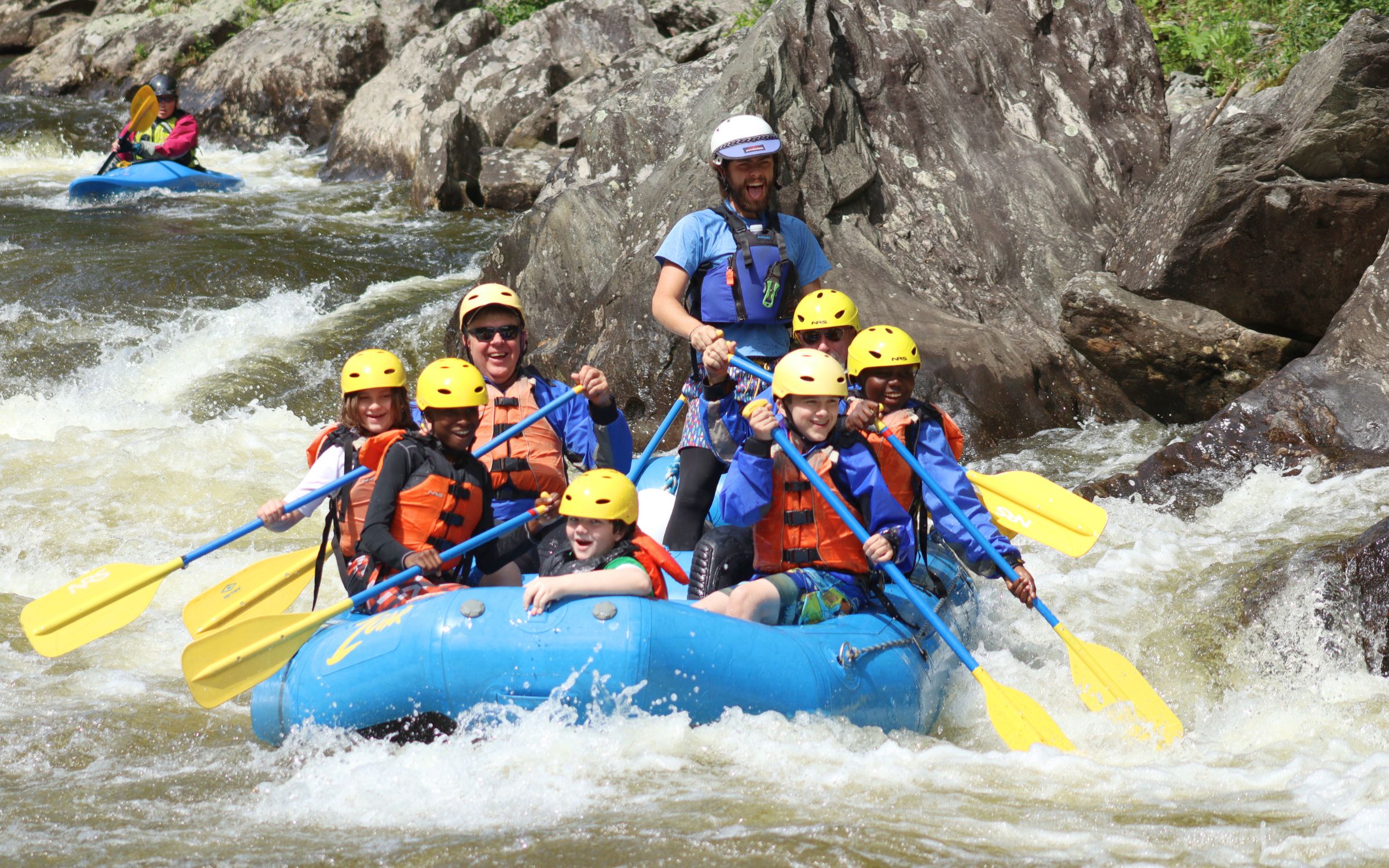 Group whitewater rafting in Charlemont - big smiles