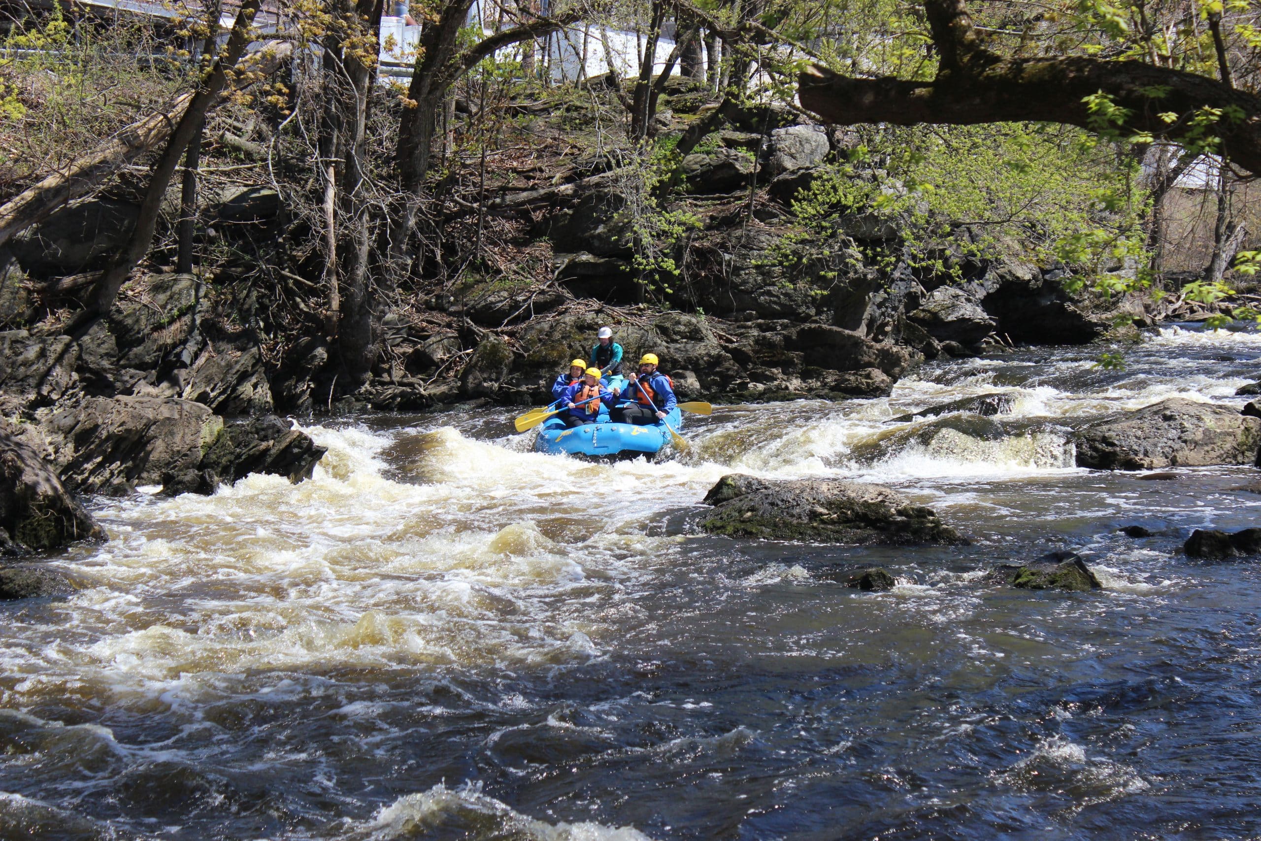 Rafters headed through a section of whitewater on a Zoar Outdoor trip