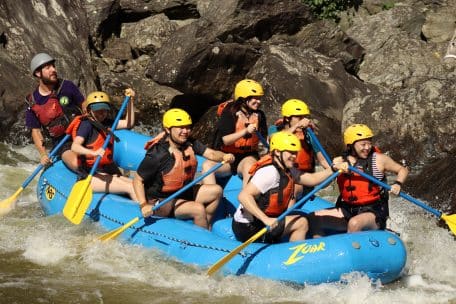 Smiling group of rafters on a Zoar whitewater rafting adventure trip