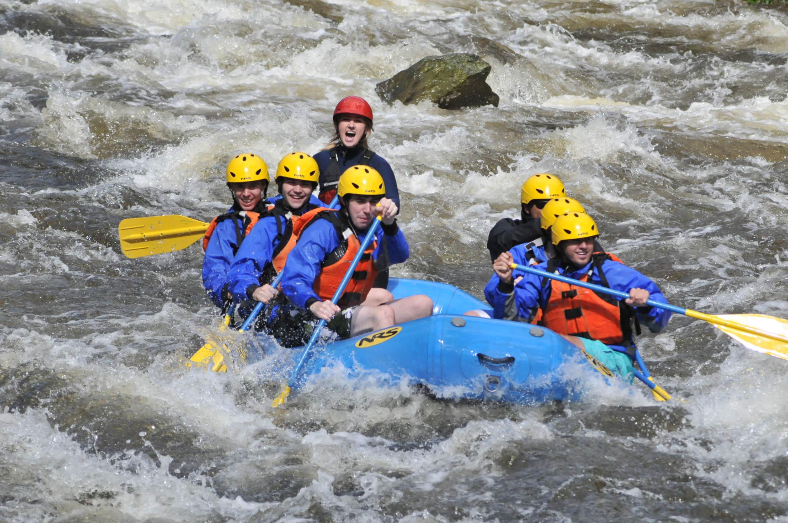 Group of young college students on the Zoar Gap trip headed through whitewater