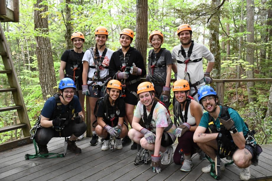 Happy group of guides on the platforms on Zoar's Canopy zipline tour.